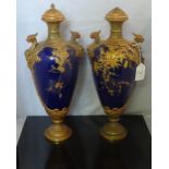 A pair of late Victorian Royal Worcester oviform vases with covers,