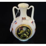 A W. H. Goss large twin handled vase, decorated with flags and armorial crest reading 'L'union