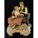 A 19th century Chelsea-style porcelain figure group of a courting couple,