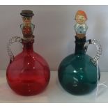 Two coloured glass jugs/decanters,