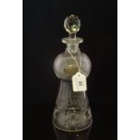 An early 20th century thistle shaped cut glass decanter,