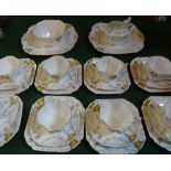 A early 20th century eight piece tea set, Queen Anne shape, having hand painted fruit decoration,