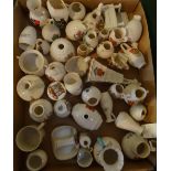 A large quantity of crested china, the majority produced by W. H. Goss.