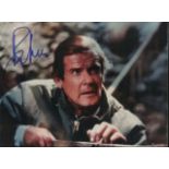 Roger Moore Colour 7x5 photo autographed by James Bond himself . Nice bold blue undedicated