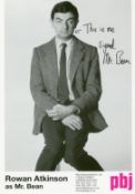 Rowan Atkinson signed promotional photo as Mr Bean.  He has signed it this is me signed Mr Bean.