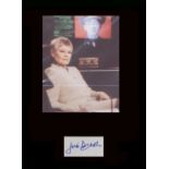 James Bond. Signature of Dame Judi Dench with picture in character from the ‘James Bond’