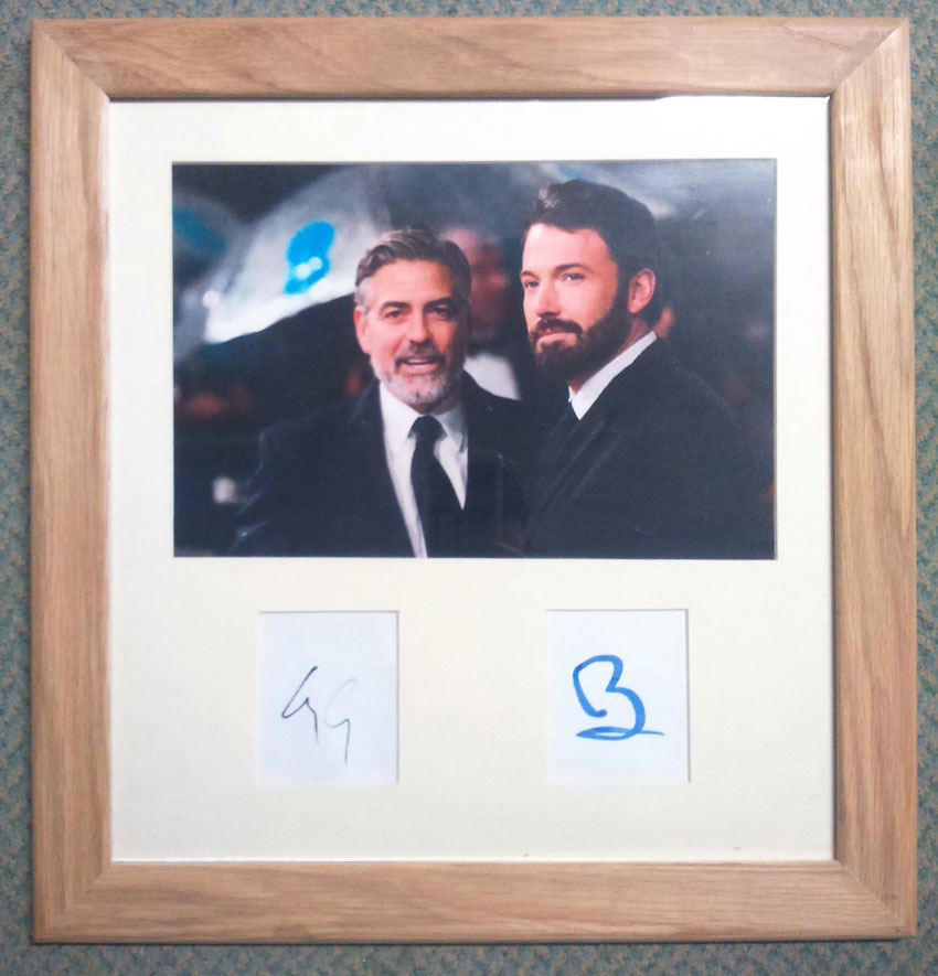 Ben Affleck and George Clooney autographed presentation. In person autographs obtained at a movie