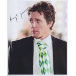 Hugh Grant. 10”x8” portrait in typical dapper pose. Excellent.