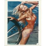 Pamela Anderson signed colour 10x8 photo in swimsuit from Baywatch. Good condition