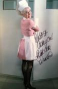 Barbara Windsor. Has Added "What A Carry On! " Signed 12 X 8 Photo. Good condition