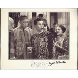 Unusual black and white 8x10 photograph from The Avengers autographed by Burt Kwouk, seen here in
