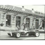 Stirling Moss Small 9cm x 12cm black and white magazine photograph signed and dedicated by legendary