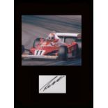 Nikki Lauda. Signature with picture in Formula 1 car. Professionally mounted in black to 16”x12”.