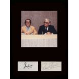 Two Ronnies. Signatures of Ronnies Barker and Corbett with a picture from the show. Professionally