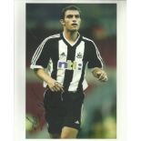 Aaron Hughes in Newcastle strip signed colour 10x8 photo. Good condition
