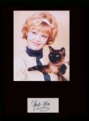 Hayley Mills. Signature with young portrait. Professionally mounted in black to 16”x12”. Excellent.