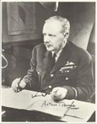 Arthur Bomber Harris signed 10 x 8 b/w photo sitting at his desk in Bomber Command. Good condition