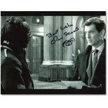 B/W still from the film “Die Another Day”, featuring Pierce Brosnan and Oliver Skeete, signed by
