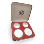 1976 Silver Coins Black Coin presentation case containing four Silver coins comm. 1976 Olympic Coins