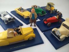 Tintin Model Cars Twelve cars mounted on blue bases with printed description plus over 20 tintin