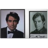 Signed publicity photo and accompanying Bond promotional image of Timothy Dalton, mounted on