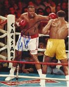 Larry Holmes signed colour boxing photo. Good condition