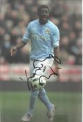 Kolo Toure in Manchester City strip signed colour 12x8 photo. Good condition