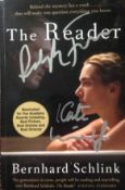 Copy of “The Reader”, signed on the front cover in silver pen by Ralph Fiennes and Kate Winslet, who