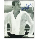 B/W promotional photo of George Lazenby’s James Bond, signed by George Lazenby in blue ink Good