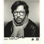 Eric Clapton signed photo. 8x10 black and white photo, clipped down to 8x8, presumably to remove a
