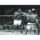 Larry Holmes signed photo. 16" x 12" high quality black and white photograph autographed by former