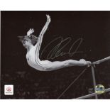 Nadia Comaneci Stunning 8x10 inch photo hand signed by Nadia Comaneci. This is an official 2012 Team