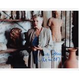 Dench Judi 10" x 8" photo clearly signed by Judi Dench in blue marker. James Bond Judi Dench