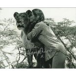 Susan Hampshire signed 10 x 8 b/w photo kissing a lioness. Good condition