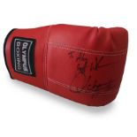 Autographed boxing glove. Olympus Training glove with an unidentified boxer autograph in black ink