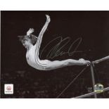 Nadia Comaneci: Stunning 8x10 inch photo hand signed by Nadia Comaneci. This is an official 2012