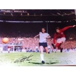 Geoff Hurst: 16x12 inch photo signed by England's 1966 World Cup hero, Geoff Hurst who remains the