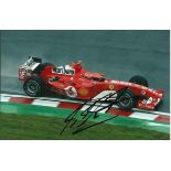 Michael Schumacher signed 6 x 4 colour Ferrari action photo. Good condition