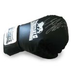 Autographed boxing glove. Full size black Lonsdale boxing glove with an unidentified boxer autograph