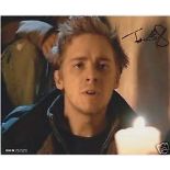 Golding Tom, A 20xcm x 25cm colour photo clearly signed by Tom Golding from Doctor Who in black