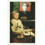 Judi Dench signed 6x4 colour James Bond postcard. Seen here as M in Goldeneye (1995). Good condition