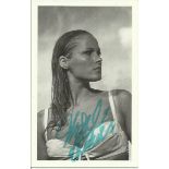 Ursula Andress signed 6x4 colour James Bond postcard. Seen here as Honey Ryder in Dr No (1962). Good