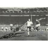 1966 Winners signed 8 x 6 inch black and white photo showing Geoff Hurst scoring in the 1966