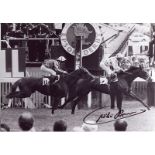 Willie Carson - 7x10 inch photo signed by Willie Carson, pictured winning the Epsom Derby on Henbit.