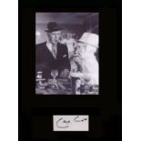 Minder - George Cole. Signature mounted with picture as ‘Arthur Daley.’ Professionally mounted in