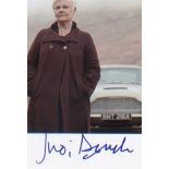 James Bond - Dame Judi Dench. P/C sized signed picture in character from ‘Bond.’ Excellent.
