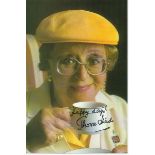 Thora Hird signed colour small photo. She has added "Happy Days" to her autograph of her holding a