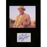 Poirot - David Suchet. Signature mounted with picture as ‘Poirot.’ professionally mounted in black
