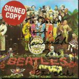 Sir Paul McCartney & Peter Blake signed to front of insert card for CD Sgt Peppers Lonely Hearts