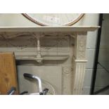 An Edwardian carved wood fire surround, 136cm high x 156cm wide